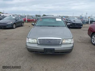 1999 Ford Crown Victoria LX with VIN 2FAFP74W4XX192490, listed as a IAAI auction lot 41791909 with 115,469 mi miles. Bid and sale history available at carsss.com. Image 6.