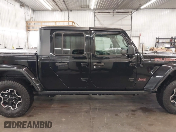 2021 Jeep Gladiator Rubicon with VIN 1C6JJTBGXML529108, listed as a IAAI auction lot 42139924 with 32,204 mi miles and . Bid and sale history available at DreamBid. Image 14.