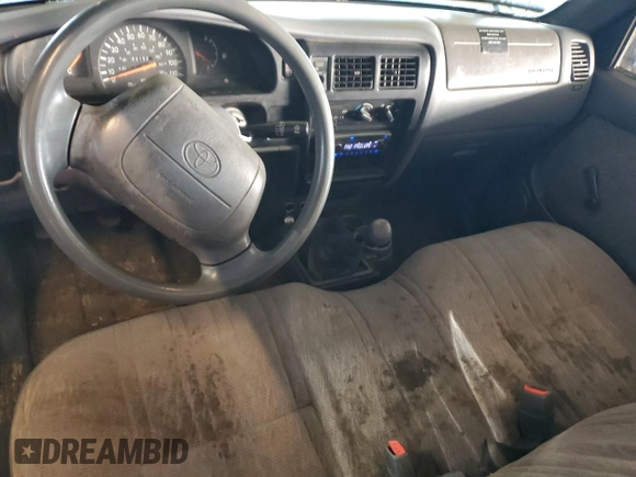 1999 Toyota Tacoma z VIN 4TANL42N6XZ561222, wystawiony jako Copart lot #45721925 z przebiegiem 221 521 mil mil oraz Szkoda całkowita • Salvage title. Historia ofert i sprzedaży dostępna na DreamBid. Obrazek 8.