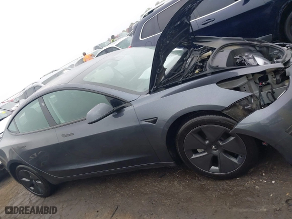 2023 Tesla Model 3 with VIN 5YJ3E1EA7PF642913, listed as a IAAI auction lot 41898249 with 26,394 mi miles. Bid and sale history available at carsss.com. Image 14.