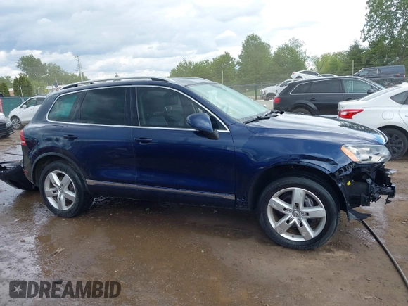 2011 Volkswagen Touareg Sport z VIN WVGFF9BP0BD002958, wystawiony jako IAAI lot #42281009 z przebiegiem 147 801 mil mil oraz . Historia ofert i sprzedaży dostępna na DreamBid. Obrazek 14.
