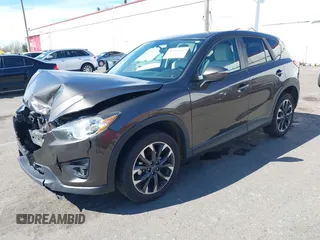 2016 Mazda CX-5 Grand Touring with VIN JM3KE2DYXG0773663, listed as a IAAI auction lot 41896367 with 86,571 mi miles and . Bid and sale history available at DreamBid. Image 18.