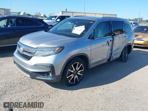 2019 Honda Pilot Elite with VIN 5FNYF6H00KB001016, listed as a IAAI auction lot 42583325 with 133,327 mi miles and . Bid and sale history available at DreamBid. Image 2.