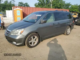 2007 Honda Odyssey Touring with VIN 5FNRL38817B071391, listed as a Copart auction lot 60557495 with 189,472 mi miles and Salvage title. Bid and sale history available at DreamBid. Image 1.