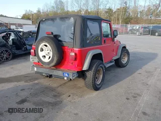 2003 Jeep Wrangler Sport with VIN 1J4FA49S13P320159, listed as a IAAI auction lot 41935699 with 212,355 mi miles. Bid and sale history available at carsss.com. Image 4.