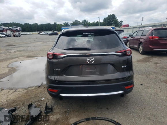 2018 Mazda CX-9 Grand Touring с VIN JM3TCADY9J0205299, выставлен на аукционе Copart как лот 60306095 с пробегом 113 766 миль миль и Списание • Salvage title. История ставок и продаж доступна на DreamBid. Изображение 6.