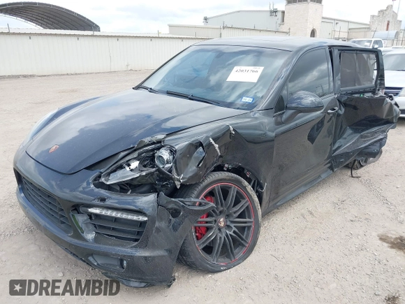 2014 Porsche Cayenne GTS with VIN WP1AD2A25ELA71350, listed as a IAAI auction lot 42031766 with 104,184 mi miles and . Bid and sale history available at DreamBid. Image 2.