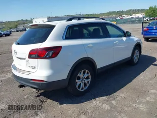 2015 Mazda CX-9 Touring with VIN JM3TB3CV1F0461403, listed as a IAAI auction lot 42148325 with 143,452 mi miles. Bid and sale history available at carsss.com. Image 4.