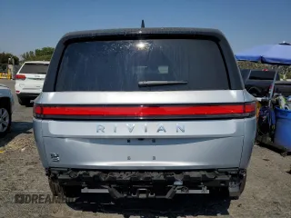 2024 Rivian R1S Adventure z VIN 7PDSGBBA7RN044642, wystawiony jako Copart lot #62567904 z przebiegiem 1888 mil mil oraz Szkody całkowita. Historia ofert i sprzedaży dostępna na DreamBid. Obrazek 6.