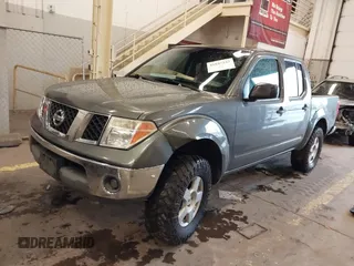 2005 Nissan Frontier 4WD LE with VIN 1N6AD07W95C411421, listed as a IAAI auction lot 41847242 with 209,816 mi miles. Bid and sale history available at carsss.com. Image 2.