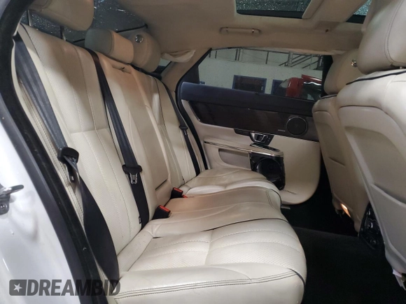 2014 Jaguar XJ Portfolio with VIN SAJWJ2GD2E8V69597, listed as a Copart auction lot 57798145 with 100,857 mi miles and Salvage title. Bid and sale history available at DreamBid. Image 10.