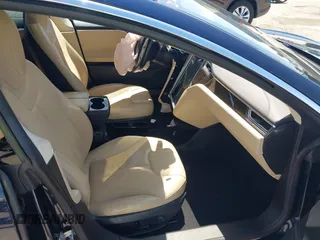 2014 Tesla Model S 60 with VIN 5YJSA1H12EFP46760, listed as a IAAI auction lot 42344596 with 106,252 mi miles and . Bid and sale history available at DreamBid. Image 5.
