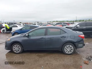 2019 Toyota Corolla L with VIN 5YFBURHE8KP873067, listed as a IAAI auction lot 41936471 with 75,076 mi miles and . Bid and sale history available at carsss.com. Image 14.