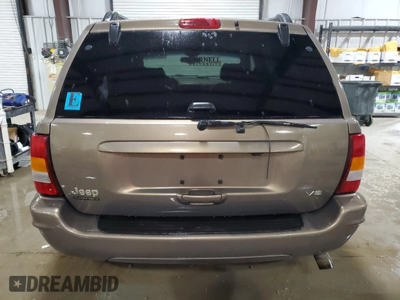 2002 Jeep Grand Cherokee Limited with VIN 1J4GW58NX2C248892, listed as a Copart auction lot 55574615 with 164,010 mi miles and Salvage title. Bid and sale history available at DreamBid. Image 6.