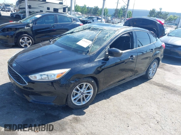 2018 Ford Focus SE z VIN 1FADP3FE9JL303933, wystawiony jako IAAI lot #42530171 z przebiegiem Nie podano mil oraz . Historia ofert i sprzedaży dostępna na DreamBid. Obrazek 2.