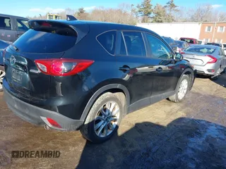 2014 Mazda CX-5 Grand Touring with VIN JM3KE4DY1E0303658, listed as a IAAI auction lot 41536769 with 158,777 mi miles. Bid and sale history available at carsss.com. Image 4.