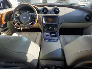 2012 Jaguar XJ with VIN SAJWA1CB3CLV37685, listed as a Copart auction lot 87586005 with 59,885 mi miles and Salvage title. Bid and sale history available at DreamBid. Image 8.
