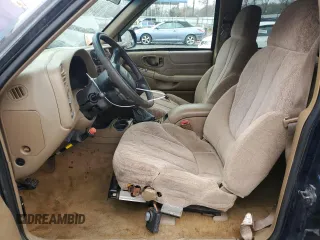 1999 GMC Jimmy SLE with VIN 1GKDT13W8X2545509, listed as a Copart auction lot 81608944 with 130,881 mi miles and Salvage Title. Bid and sale history available at carsss.com. Image 7.