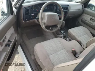 1998 Toyota Tacoma with VIN 4TAWN72N8WZ113174, listed as a Copart auction lot 84641064 with 148,221 mi miles and Salvage Title. Bid and sale history available at DreamBid. Image 8.