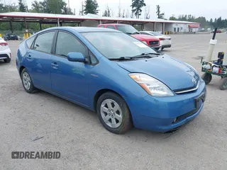 2006 Toyota Prius z VIN JTDKB20U167529006, wystawiony jako IAAI lot #42460594 z przebiegiem 83 945 mil mil oraz . Historia ofert i sprzedaży dostępna na DreamBid. Obrazek 1.
