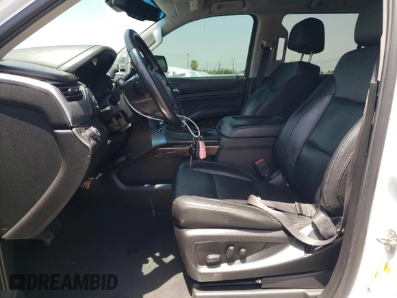 2019 Chevrolet Suburban LT with VIN 1GNSCHKCXKR207233, listed as a Copart auction lot 55410464 with 107,500 mi miles and Salvage Title. Bid and sale history available at DreamBid. Image 7.