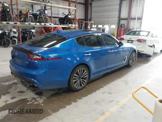 2018 Kia Stinger Premium with VIN KNAE25LA5J6017132, listed as a IAAI auction lot 42163195 with 176,947 mi miles. Bid and sale history available at carsss.com. Image 4.