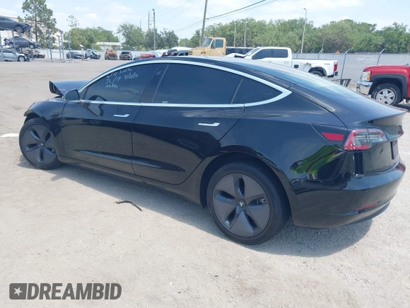 2020 Tesla Model 3 Standard Range Plus z VIN 5YJ3E1EA9LF738102, wystawiony jako IAAI lot #42107744 z przebiegiem 73 294 mil mil oraz . Historia ofert i sprzedaży dostępna na DreamBid. Obrazek 3.