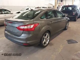 2013 Ford Focus Titanium with VIN 1FADP3J23DL265049, listed as a IAAI auction lot 41765621 with 100,550 mi miles and . Bid and sale history available at carsss.com. Image 4.