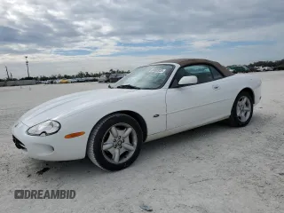 1999 Jaguar XK with VIN SAJGX204XXC040007, listed as a Copart auction lot 89092035 with 44,673 mi miles and Salvage Title. Bid and sale history available at DreamBid. Image 1.