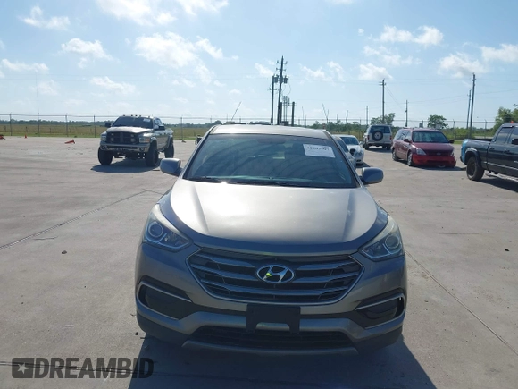 2017 Hyundai Santa Fe 2.4L z VIN 5XYZTDLB7HG444033, wystawiony jako IAAI lot #42263907 z przebiegiem 107 454 mil mil oraz . Historia ofert i sprzedaży dostępna na DreamBid. Obrazek 12.