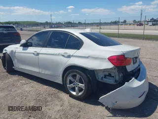 2014 BMW 3 Series 320i with VIN WBA3B1C51EK131063, listed as a IAAI auction lot 42043086 with 92,306 mi miles. Bid and sale history available at carsss.com. Image 3.