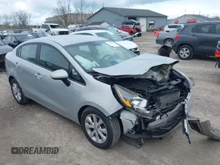 2014 Kia Rio EX with VIN KNADN4A36E6338670, listed as a IAAI auction lot 42035501 with 166,561 mi miles. Bid and sale history available at carsss.com. Image 1.