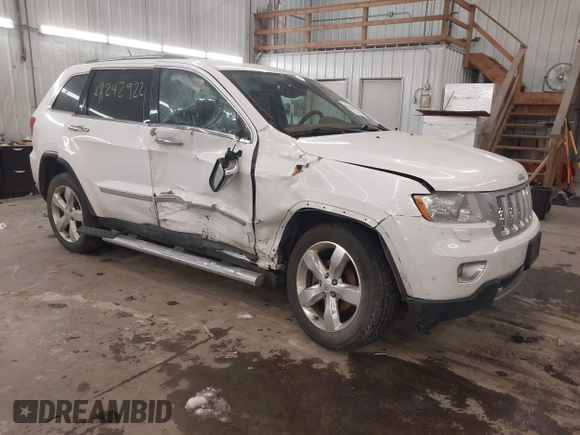 2013 Jeep Grand Cherokee Overland with VIN 1C4RJFCG7DC581808, listed as a IAAI auction lot 41242922 with 187,442 mi miles. Bid and sale history available at carsss.com. Image 1.