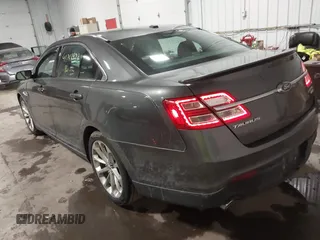 2015 Ford Taurus Limited with VIN 1FAHP2J86FG106828, listed as a IAAI auction lot 41748997 with 221,216 mi miles. Bid and sale history available at carsss.com. Image 3.
