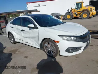 2017 Honda Civic Sedan EX-L with VIN 2HGFC1F71HH636172, listed as a IAAI auction lot 38464968 with 74,030 mi miles. Bid and sale history available at carsss.com. Image 1.