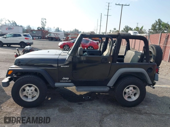 2003 Jeep Wrangler Sport with VIN 1J4FA49S23P328867, listed as a IAAI auction lot 41354414 with 96,703 mi miles. Bid and sale history available at carsss.com. Image 14.
