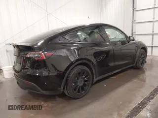 2021 Tesla Model Y Long Range with VIN 5YJYGAEE5MF305655, listed as a IAAI auction lot 41860993 with 50,750 mi miles. Bid and sale history available at carsss.com. Image 4.