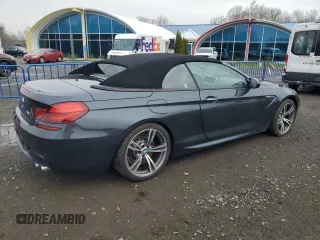 2013 BMW M6 z VIN WBSLZ9C55DDZ77804, wystawiony jako Copart lot #54121185 z przebiegiem 66 286 mil mil oraz Czysty tytuł • Clean title. Historia ofert i sprzedaży dostępna na DreamBid. Obrazek 3.