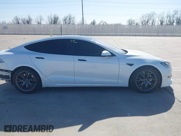2022 Tesla Model S Plaid with VIN 5YJSA1E69NF486471, listed as a IAAI auction lot 41228818 with 49,207 mi miles and . Bid and sale history available at carsss.com. Image 13.