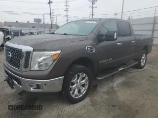 2016 Nissan Titan XD Platinum Reserve with VIN 1N6BA1F2XGN501136, listed as a Copart auction lot 82671694 with 79,469 mi miles and Salvage Title. Bid and sale history available at carsss.com. Image 1.