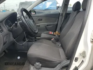 2009 Kia Rio LX with VIN KNADE223996526222, listed as a Copart auction lot 69976484 with 318,702 mi miles and Salvage Title. Bid and sale history available at DreamBid. Image 7.