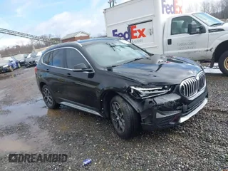 2021 BMW X1 xDrive28i with VIN WBXJG9C03M5S33561, listed as a IAAI auction lot 41541581 with 40,197 mi miles. Bid and sale history available at carsss.com. Image 1.