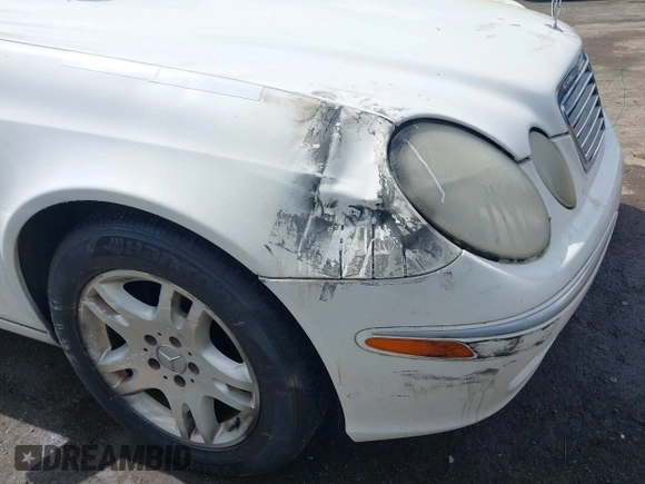 2003 Mercedes-Benz E-Class 3.2L with VIN WDBUF65J23A120318, listed as a IAAI auction lot 41927993 with 113,578 mi miles. Bid and sale history available at carsss.com. Image 6.