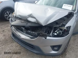 2015 Mazda CX-5 Touring with VIN JM3KE2CYXF0435583, listed as a IAAI auction lot 41737810 with 107,270 mi miles and . Bid and sale history available at DreamBid. Image 17.