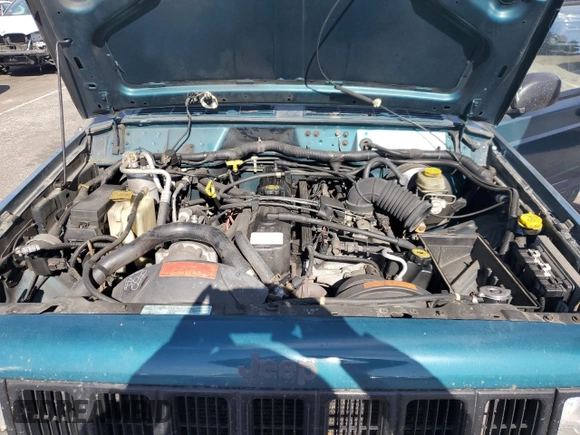 1997 Jeep Cherokee Sport with VIN 1J4FT68S4VL545385, listed as a Copart auction lot 49616325 with 239,798 mi miles and Salvage Title. Bid and sale history available at carsss.com. Image 12.