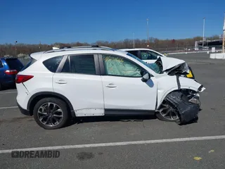 2016 Mazda CX-5 Grand Touring with VIN JM3KE4DY9G0706192, listed as a IAAI auction lot 41824828 with Not Provided miles and . Bid and sale history available at DreamBid. Image 13.