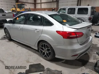 2015 Ford Focus SE with VIN 1FADP3F24FL272863, listed as a IAAI auction lot 41561084 with 103,875 mi miles. Bid and sale history available at carsss.com. Image 3.