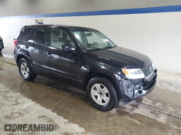 2009 Suzuki Grand Vitara with VIN JS3TE042694100010, listed as a Copart auction lot 56716225 with 148,495 mi miles and Salvage title. Bid and sale history available at DreamBid. Image 4.