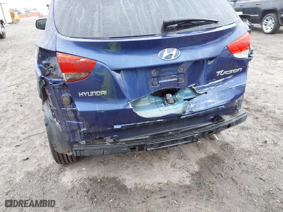 2012 Hyundai Tucson Limited with VIN KM8JU3AC1CU534989, listed as a IAAI auction lot 41513858 with 133,660 mi miles. Bid and sale history available at carsss.com. Image 6.