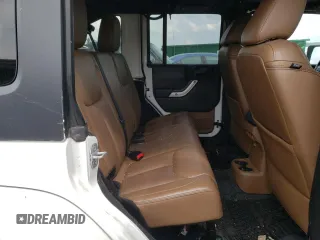 2013 Jeep Wrangler Unlimited Sahara with VIN 1C4HJWEG9DL628684, listed as a Copart auction lot 57672175 with 69,010 mi miles and Salvage title. Bid and sale history available at DreamBid. Image 11.